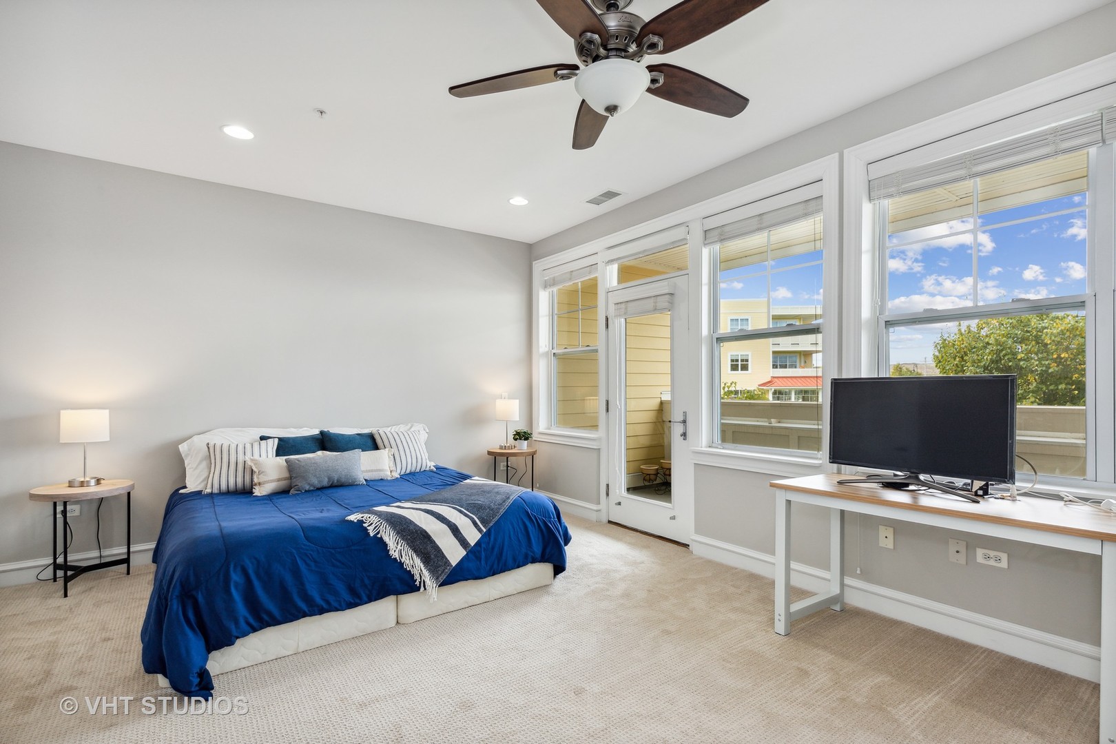 977 Harris Road, Unit 11 Grayslake, IL 60030 - Photo 11 of 30 a bedroom with a large bed and flat tv