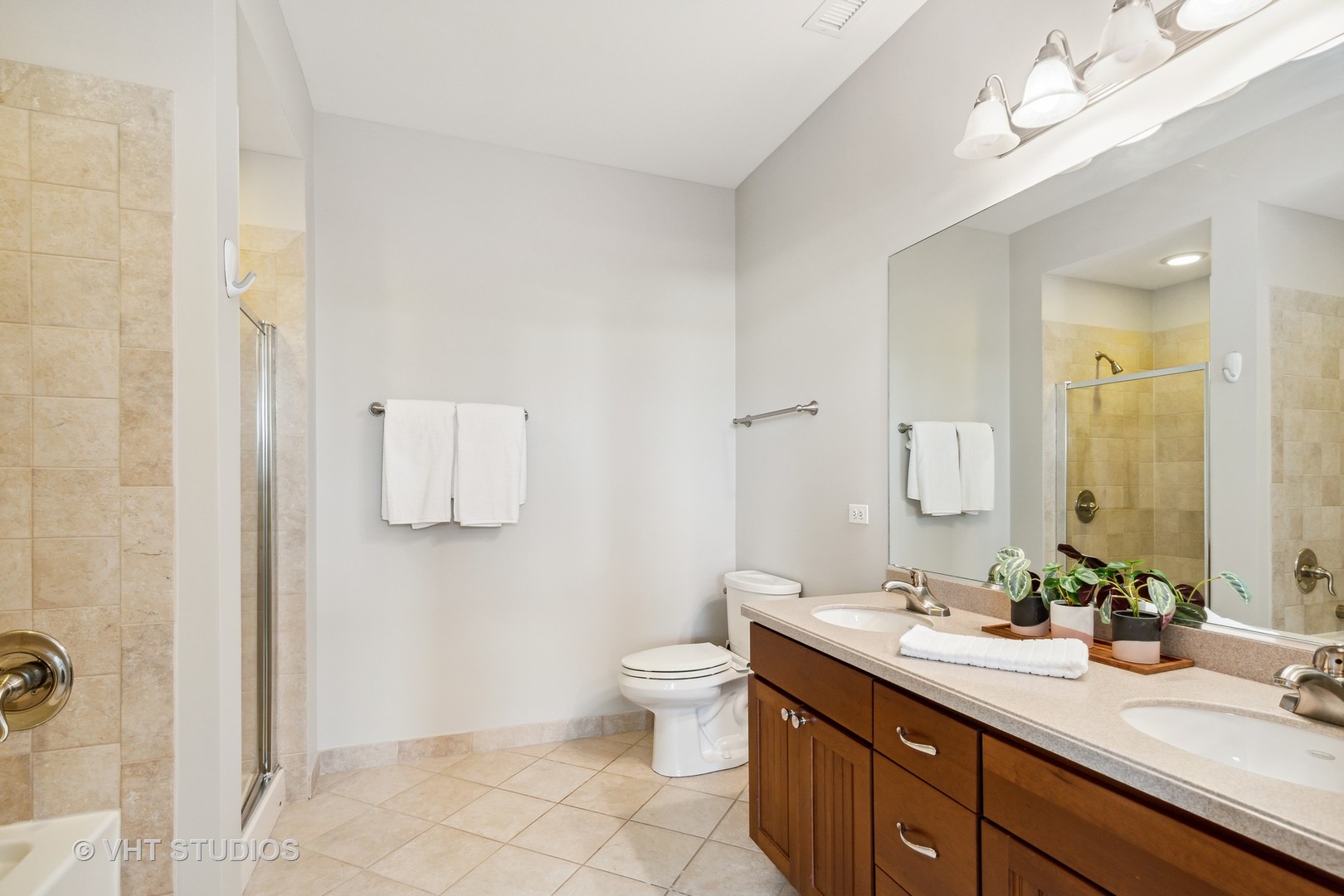 977 Harris Road, Unit 11 Grayslake, IL 60030 - Photo 12 of 30 a bathroom with a double vanity sink mirror and toilet