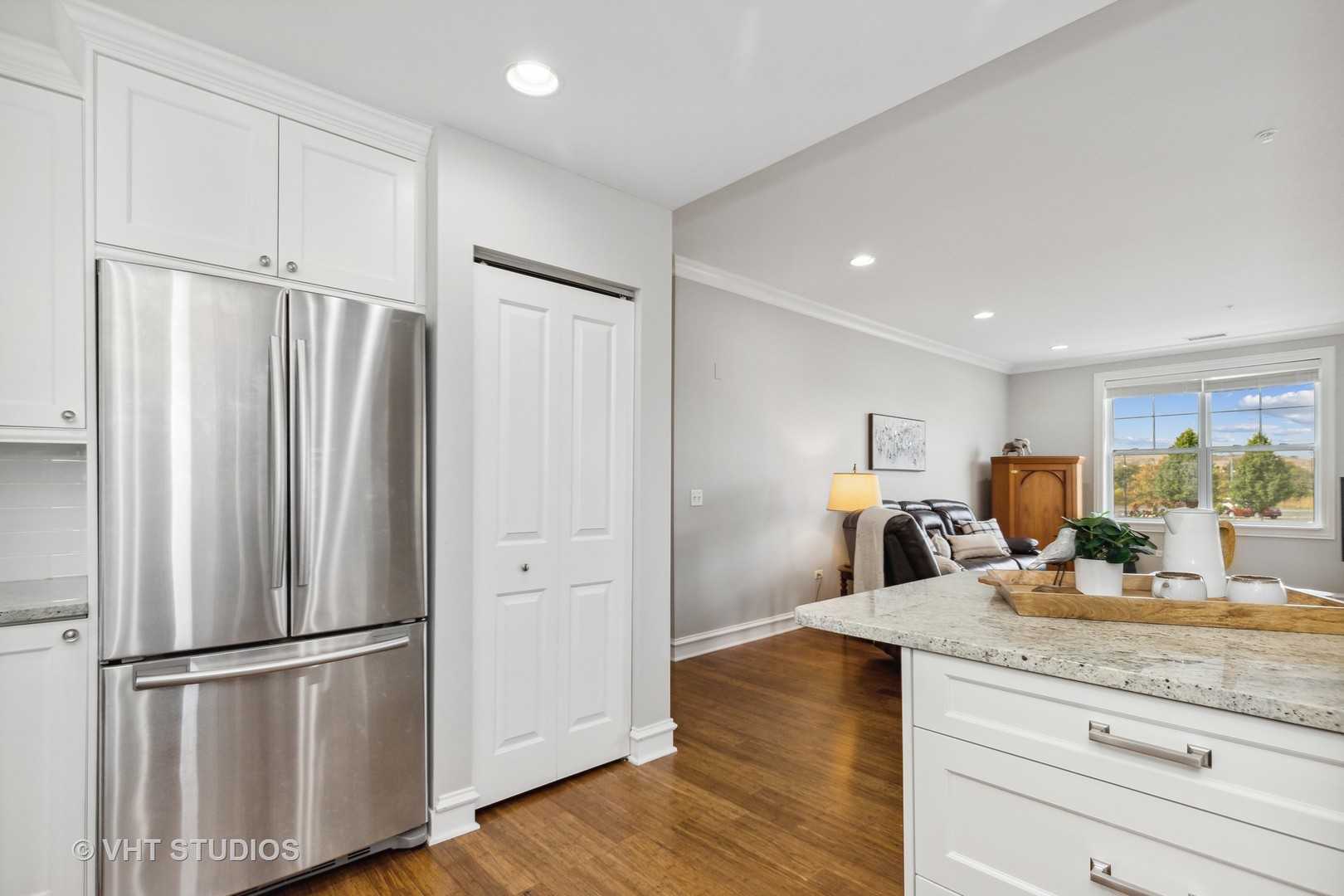 977 Harris Road, Unit 11 Grayslake, IL 60030 - Photo 3 of 30 a kitchen with stainless steel appliances granite countertop a refrigerator sink and white cabinets