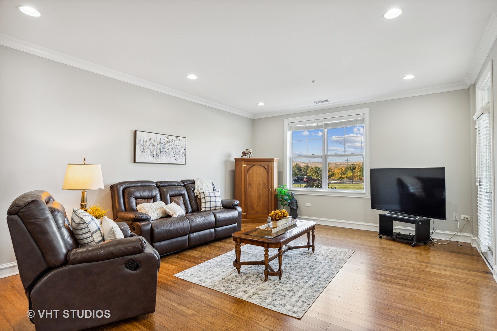 977 Harris Road, Unit 11 Grayslake, IL 60030 - Photo 7 of 30 a living room with furniture and a flat screen tv