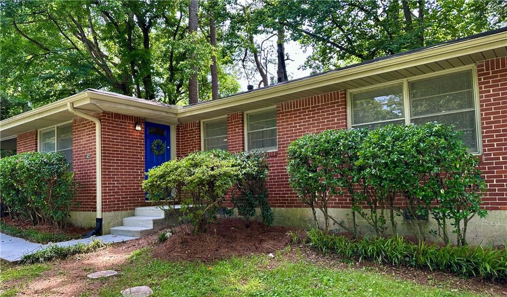 1403 Dennis Drive Decatur, GA 30032 - Photo 1 of 1 a front view of a house with garden