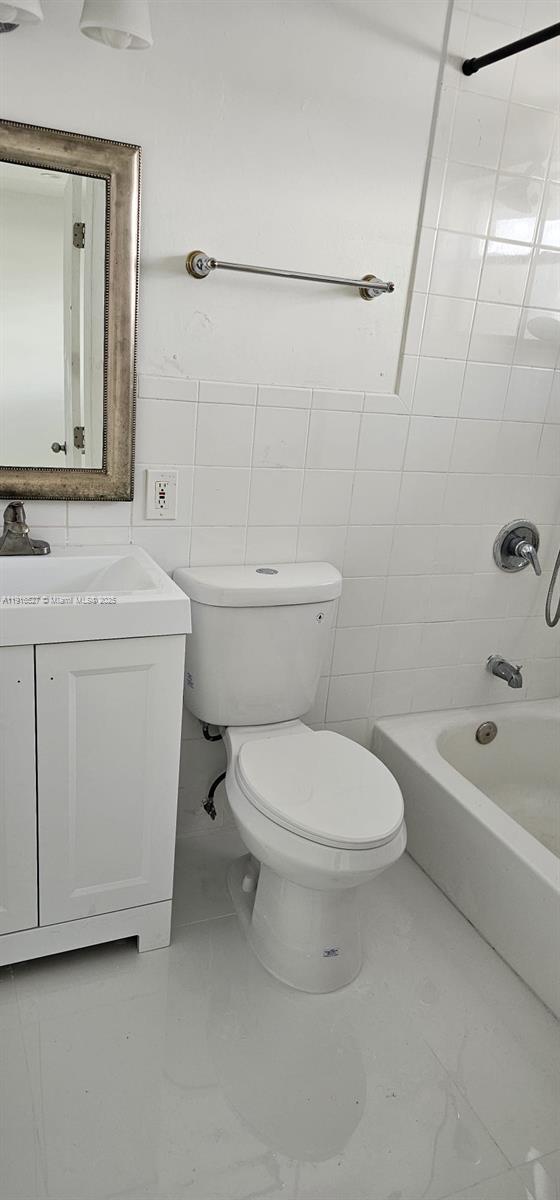 9375 Southwest 40th Terrace, Unit 203 Miami, FL 33165 - Photo 6 of 7 a bathroom with a sink a toilet and shower