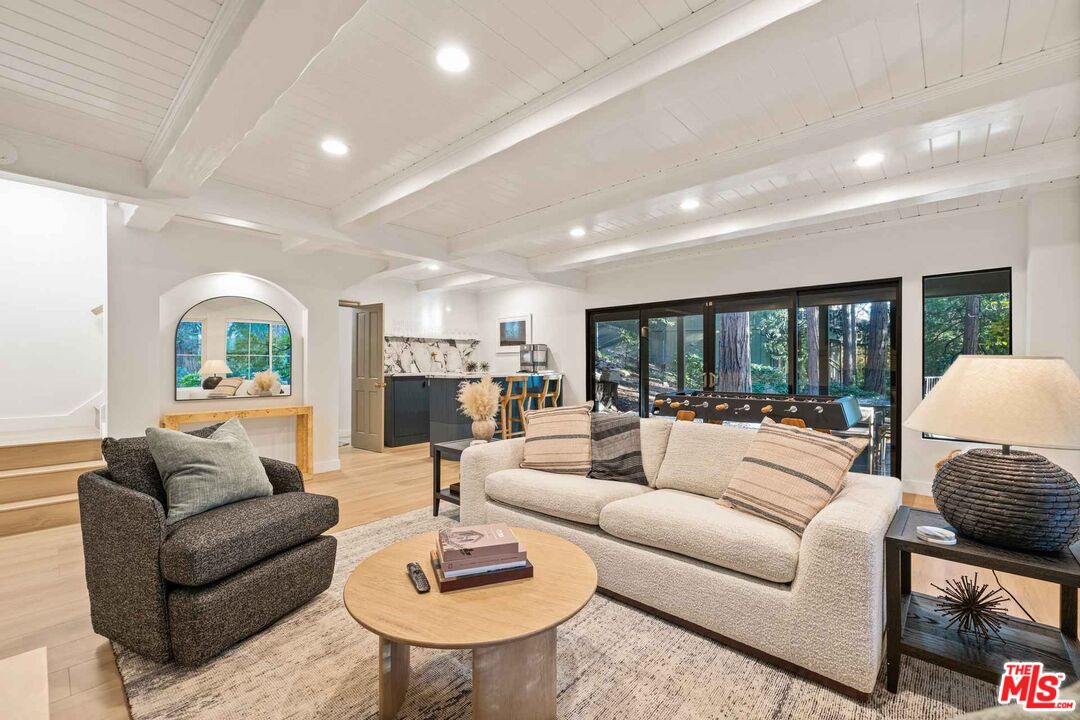 27643 West Shore Road, Unit 1 Lake Arrowhead, CA 92352 - Photo 18 of 31 a living room with furniture and a large window