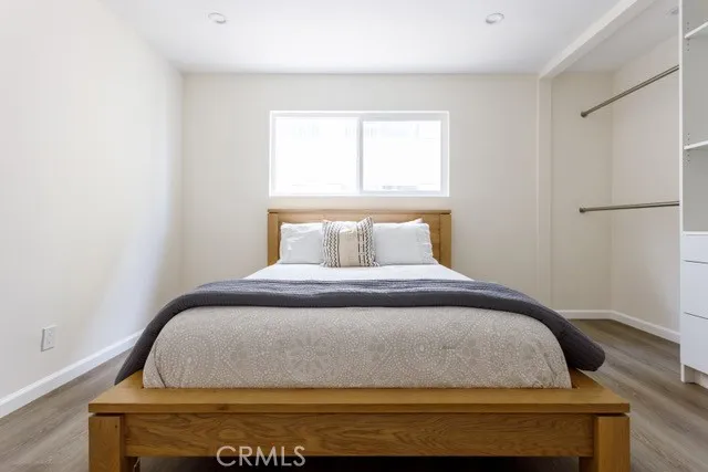 a bedroom with a bed and window