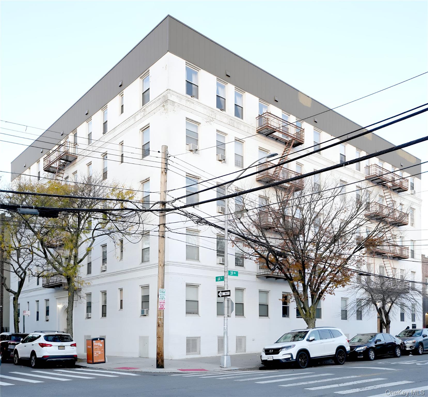 3775 64th Street, Unit 31 Queens, NY 11377 - Photo 1 of 18 a view of a building with a street