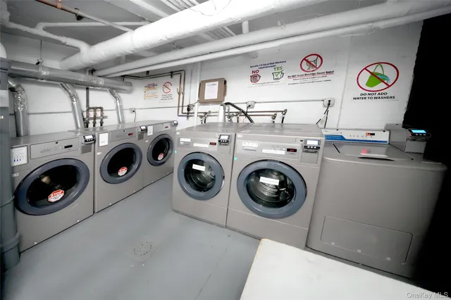 a utility room with dryer washer and other items