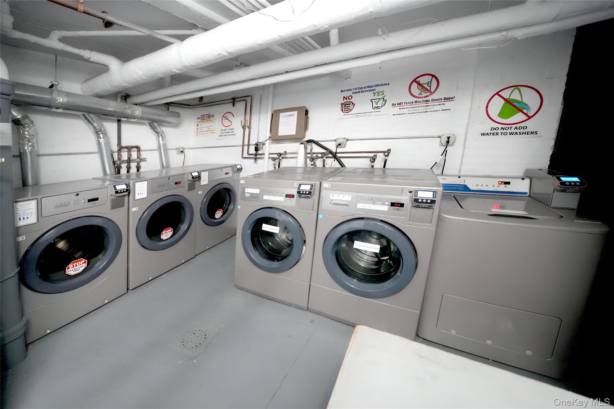 3775 64th Street, Unit 31 Queens, NY 11377 - Photo 15 of 18 a utility room with dryer washer and other items