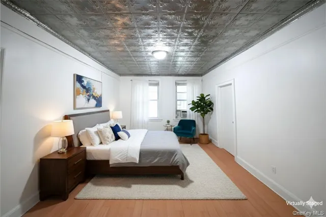 a bedroom with a large bed and a couch