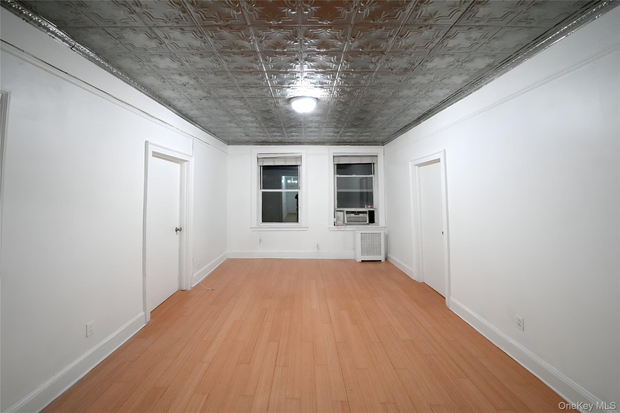 3775 64th Street, Unit 31 Queens, NY 11377 - Photo 6 of 18 a view of empty room with wooden floor