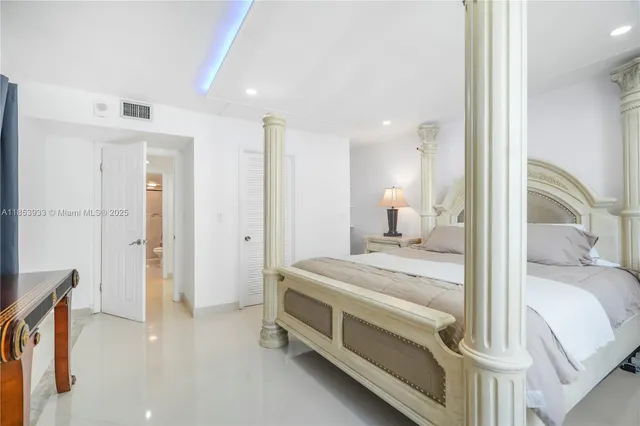 a bedroom with a bed and a view of bedroom