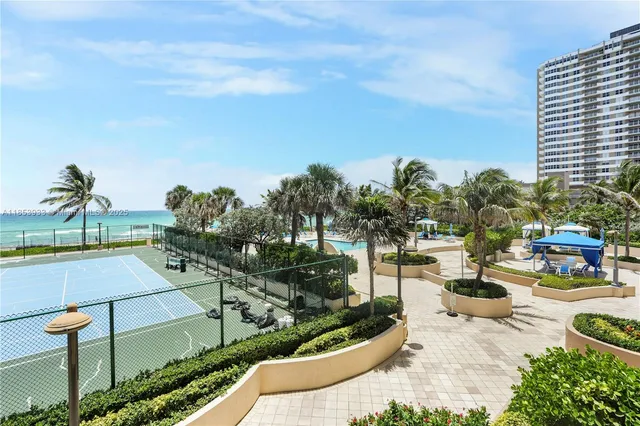a view of a terrace with chairs and a fire pit