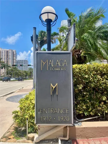 a sign that is on the side of a building