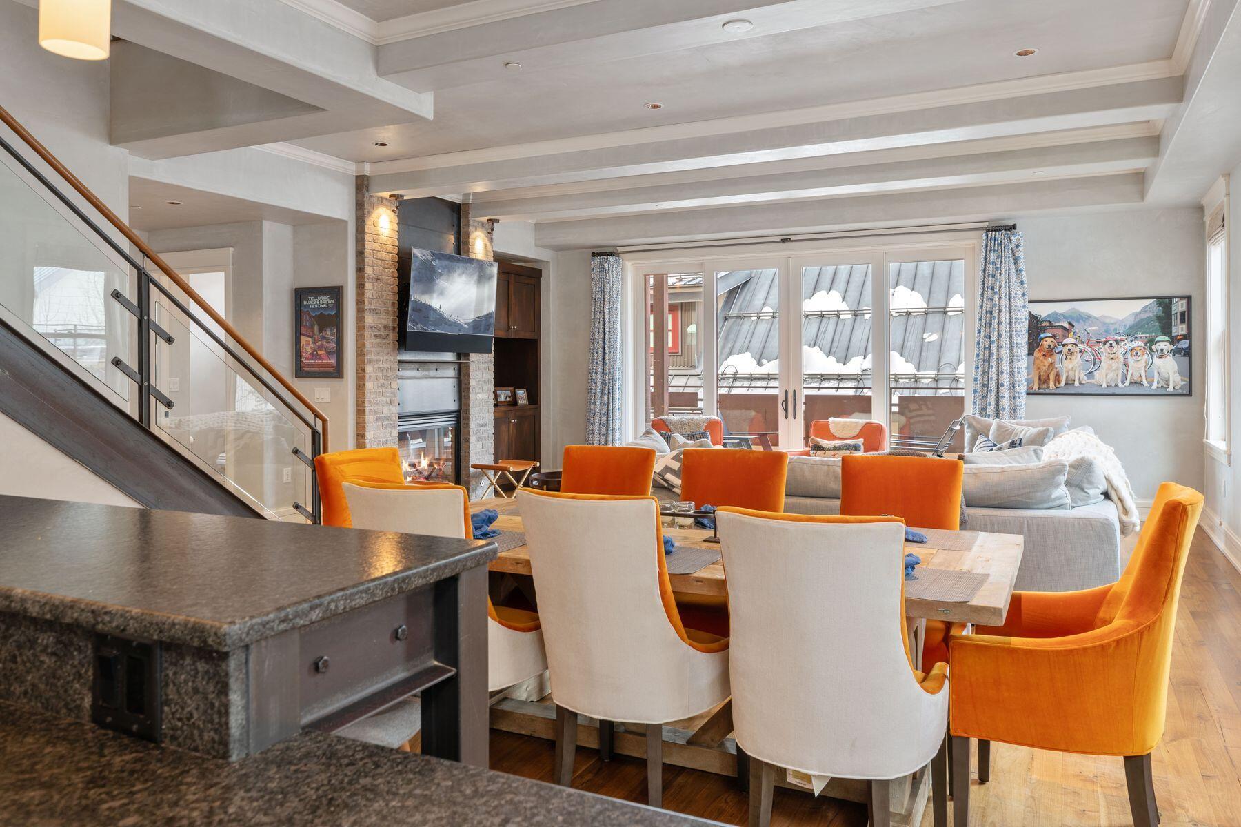 398 South Davis Street, Unit SW402 Telluride, CO 81435 - Photo 12 of 44 a view of a dining room with furniture window and wooden floor