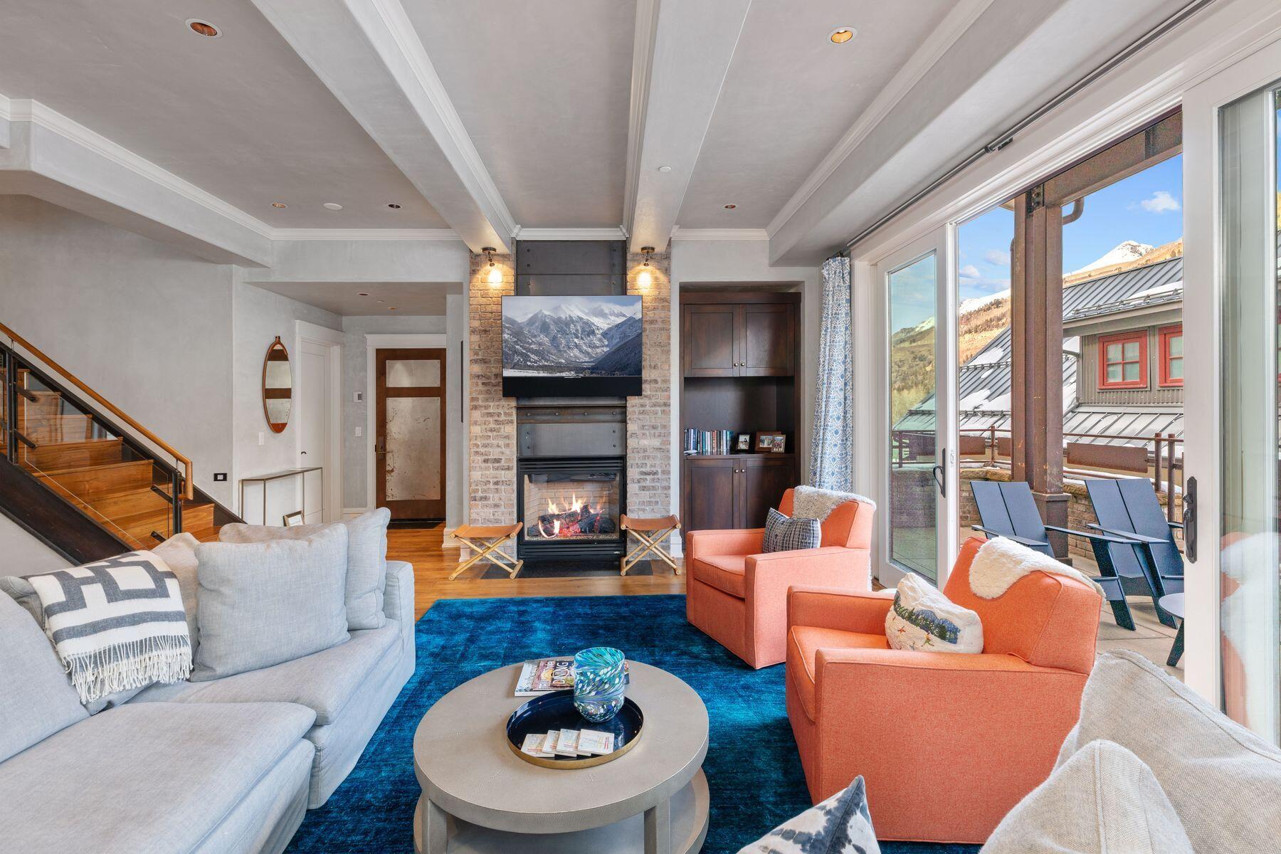 398 South Davis Street, Unit SW402 Telluride, CO 81435 - Photo 14 of 44 a living room with furniture and a fireplace