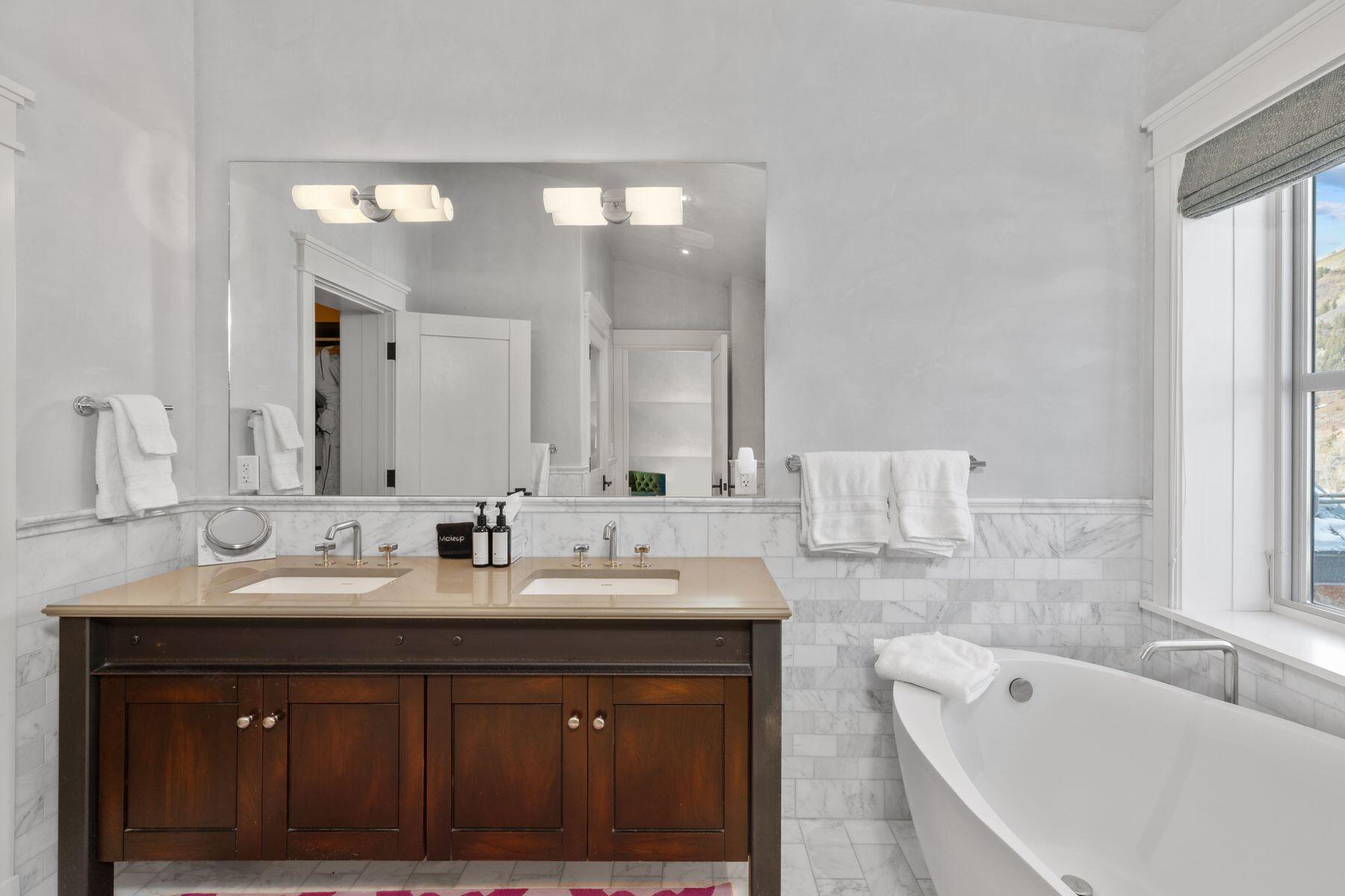 398 South Davis Street, Unit SW402 Telluride, CO 81435 - Photo 16 of 44 a bathroom with a double vanity sink mirror and double