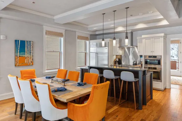 a view of a dining room with furniture and wooden floor