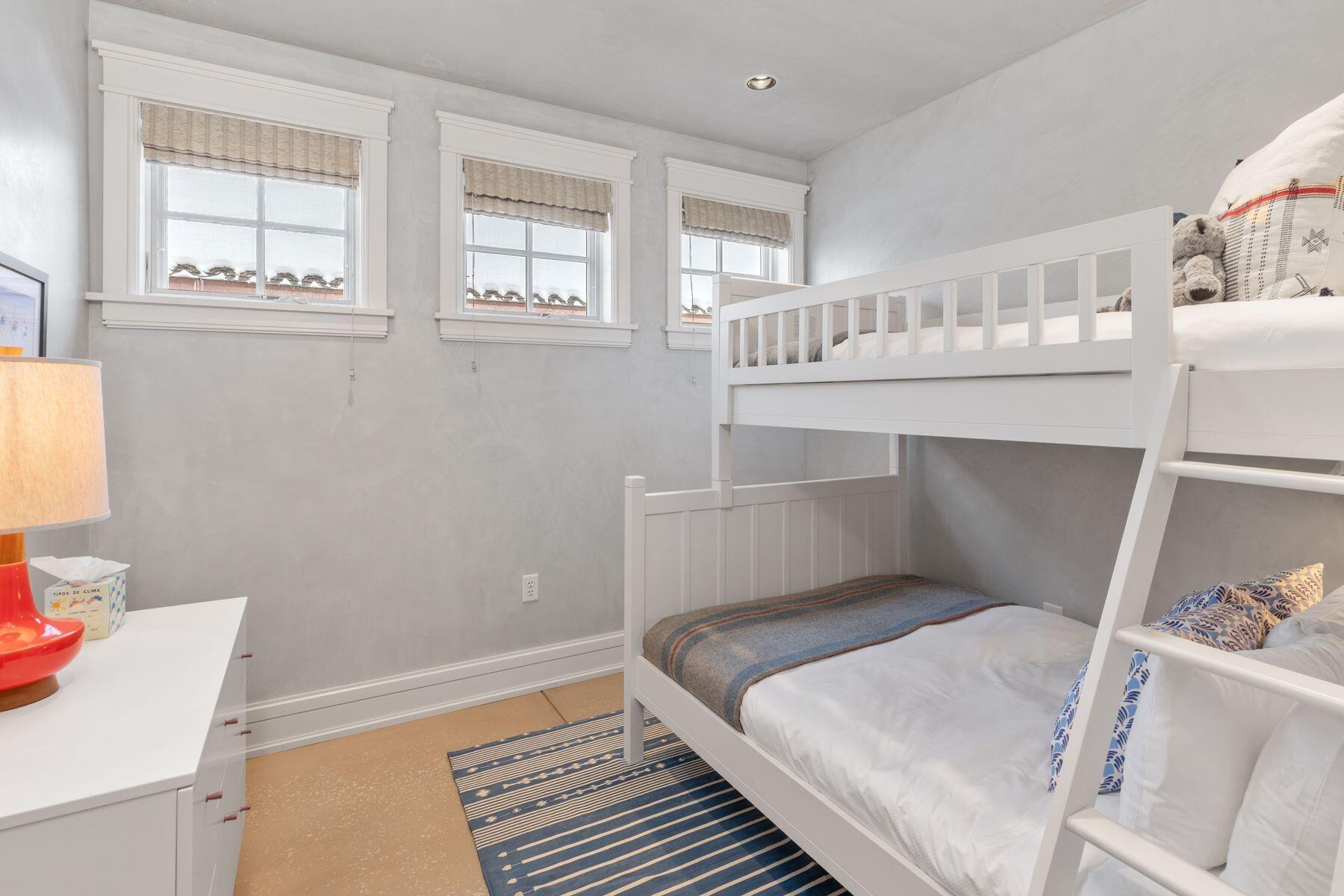 398 South Davis Street, Unit SW402 Telluride, CO 81435 - Photo 19 of 44 a bedroom with a bed and a cabinets