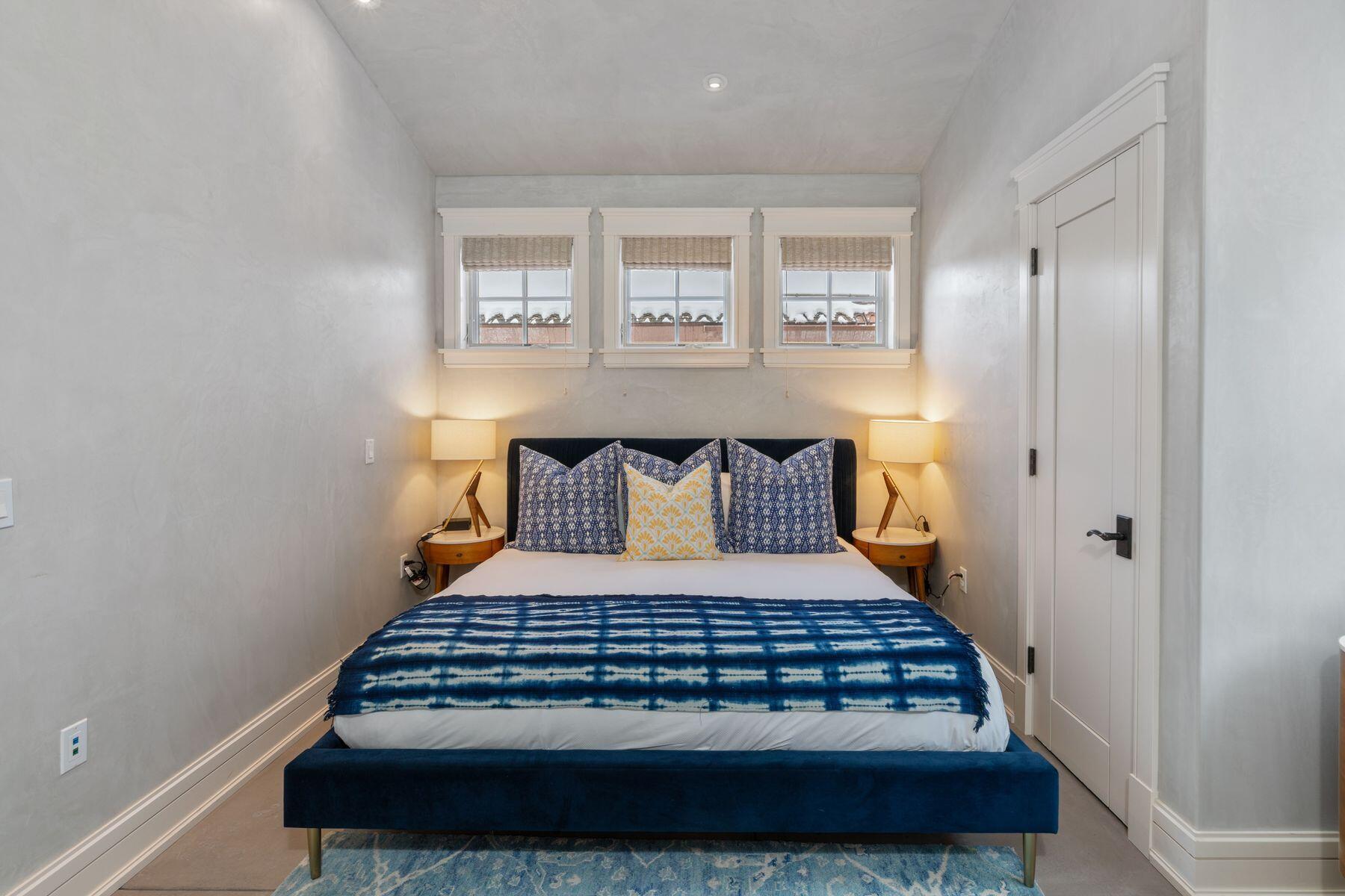 398 South Davis Street, Unit SW402 Telluride, CO 81435 - Photo 22 of 44 a bedroom with a bed and window