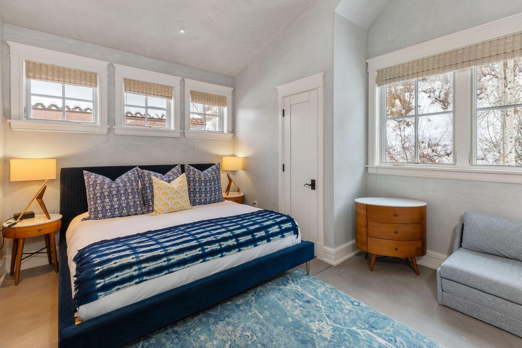 398 South Davis Street, Unit SW402 Telluride, CO 81435 - Photo 23 of 44 a bedroom with a bed and a couch with window