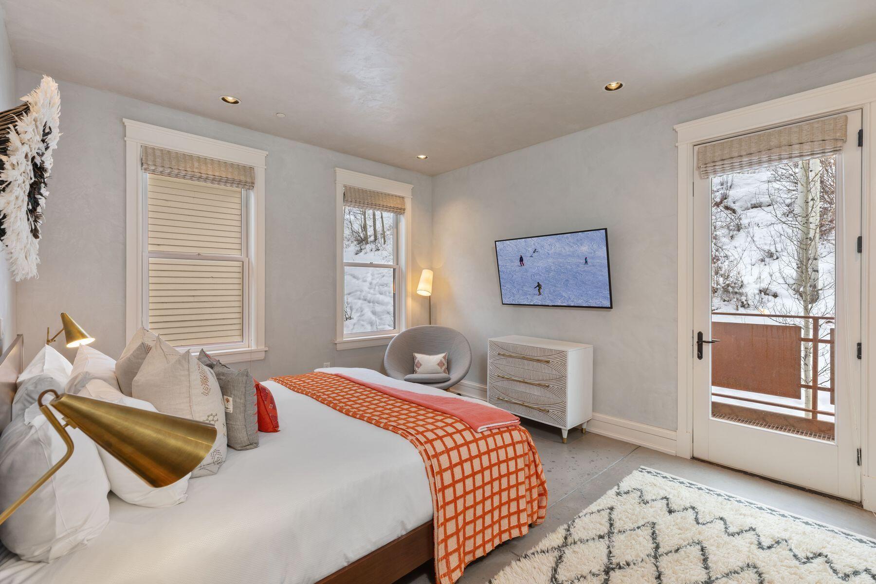 398 South Davis Street, Unit SW402 Telluride, CO 81435 - Photo 26 of 44 a bedroom with a bed and wooden floor