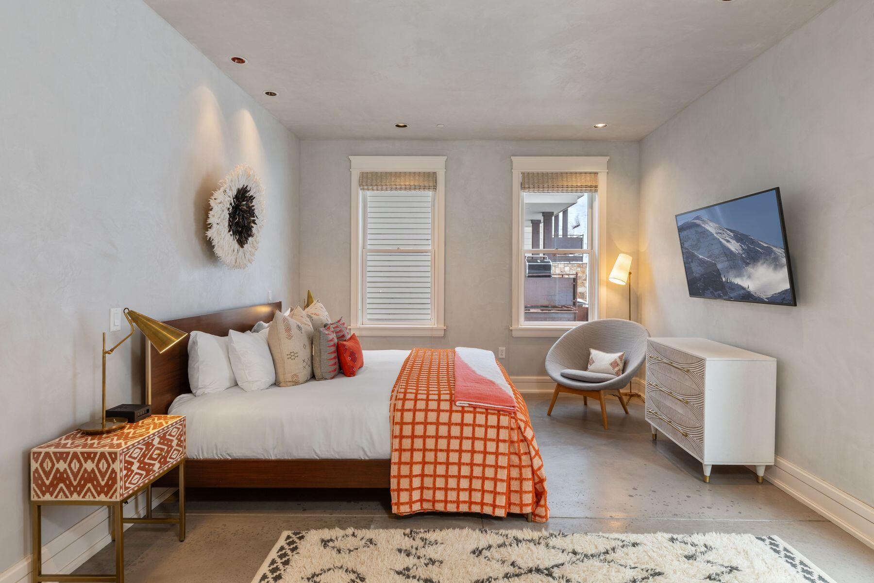 398 South Davis Street, Unit SW402 Telluride, CO 81435 - Photo 27 of 44 a bedroom with a bed and dresser