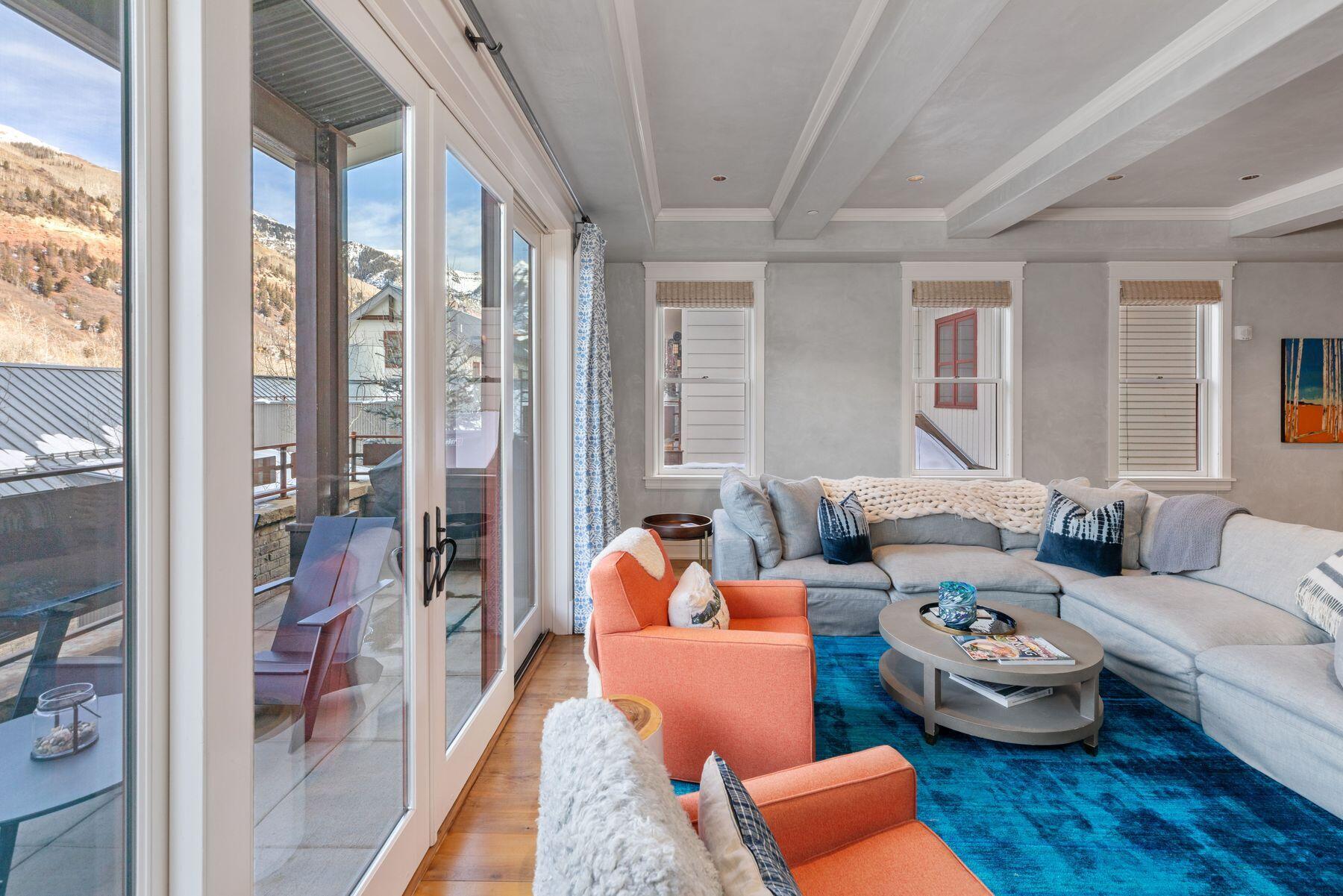 398 South Davis Street, Unit SW402 Telluride, CO 81435 - Photo 4 of 44 a bedroom with furniture and a large window