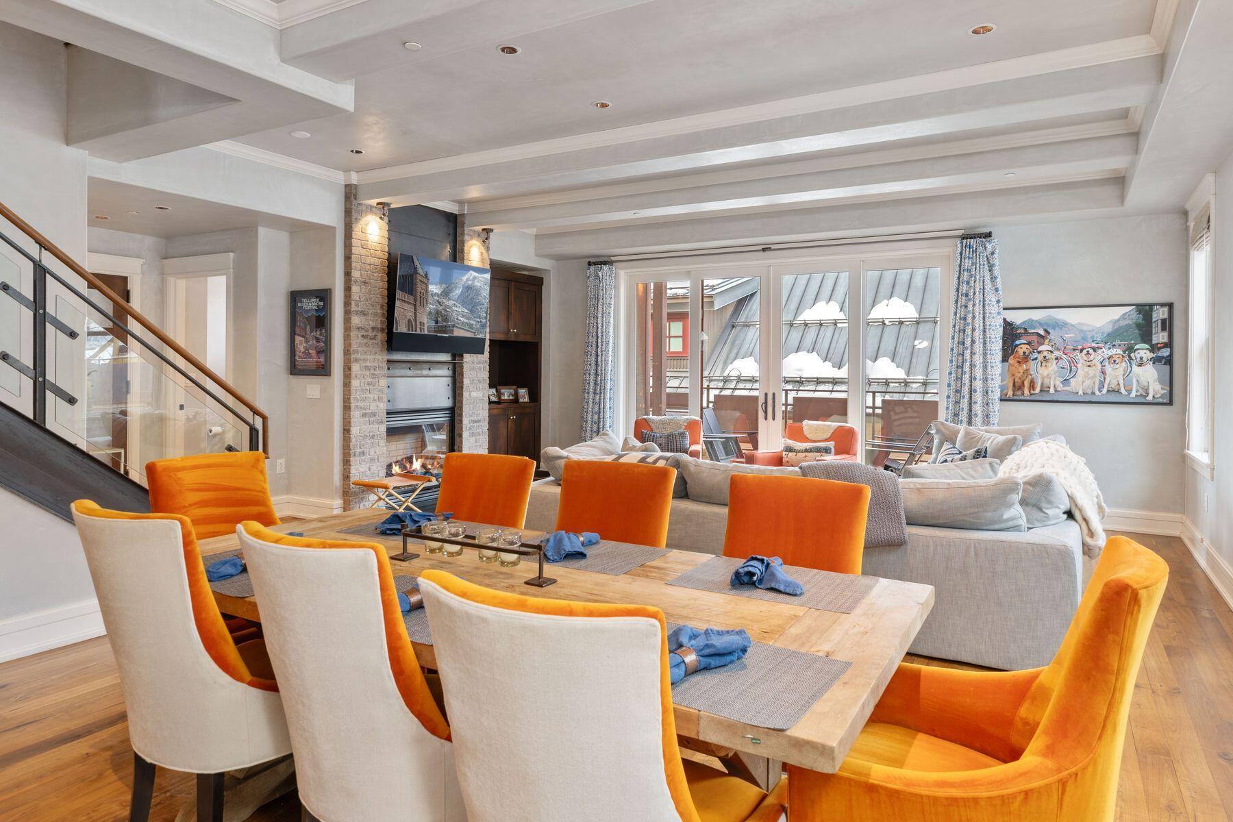 398 South Davis Street, Unit SW402 Telluride, CO 81435 - Photo 4 of 44 a living room with furniture a fireplace and a large window