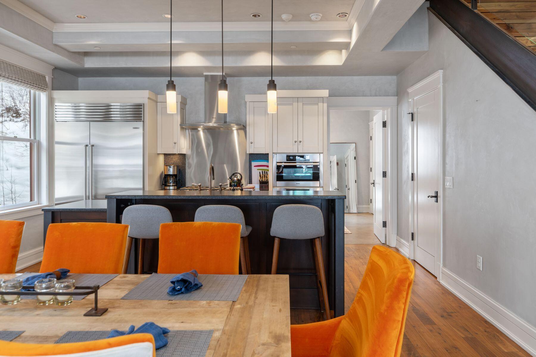 398 South Davis Street, Unit SW402 Telluride, CO 81435 - Photo 44 of 44 a view of a dining room with furniture and a chandelier