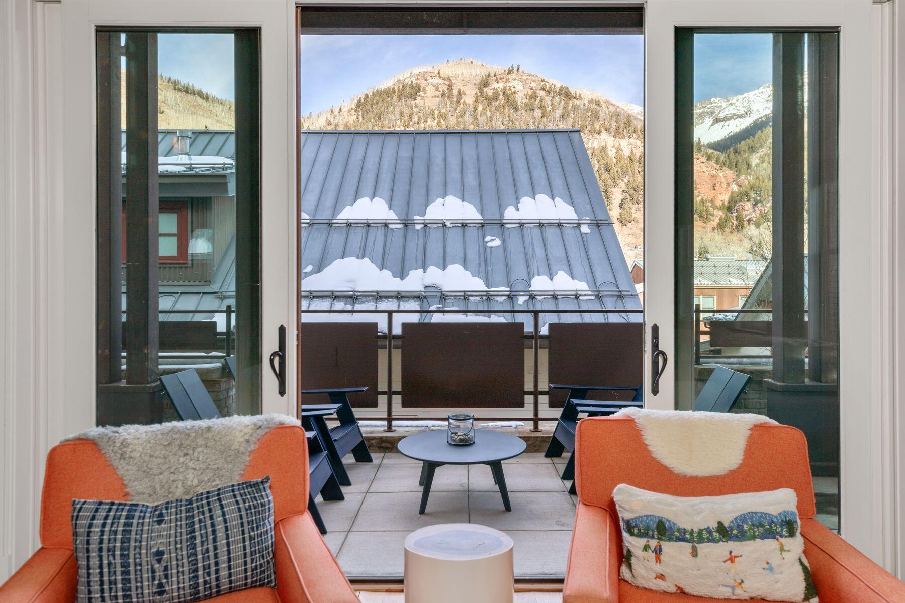 398 South Davis Street, Unit SW402 Telluride, CO 81435 - Photo 6 of 44 an outdoor sitting area with a tub and glass windows