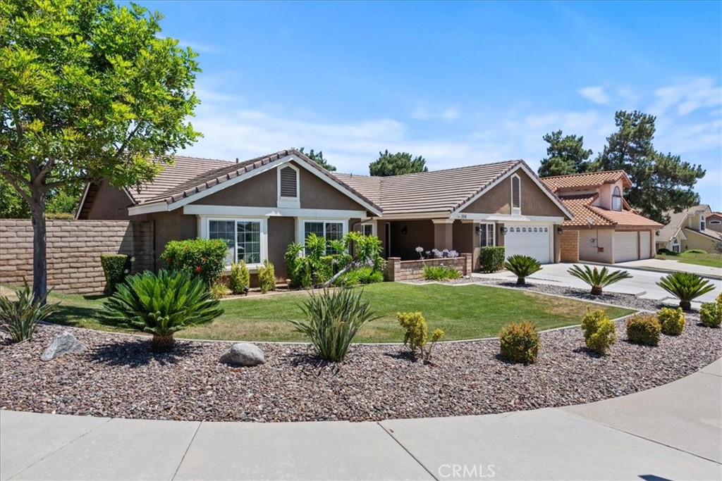 106 Bracebridge Court Riverside, CA 92506 - Photo 2 of 48 a front view of a house with a yard and porch