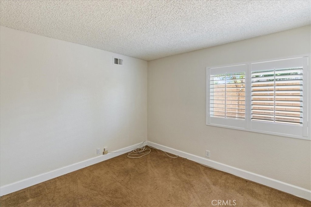 106 Bracebridge Court Riverside, CA 92506 - Photo 21 of 48 an empty room with a window