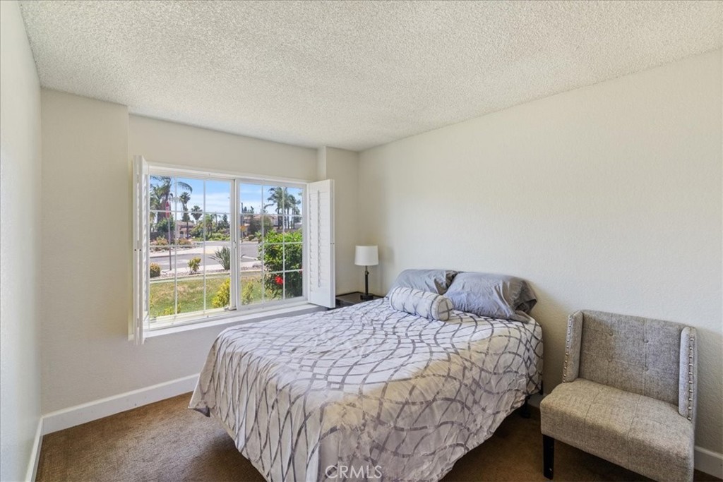 106 Bracebridge Court Riverside, CA 92506 - Photo 22 of 48 a bedroom with a bed and a couch