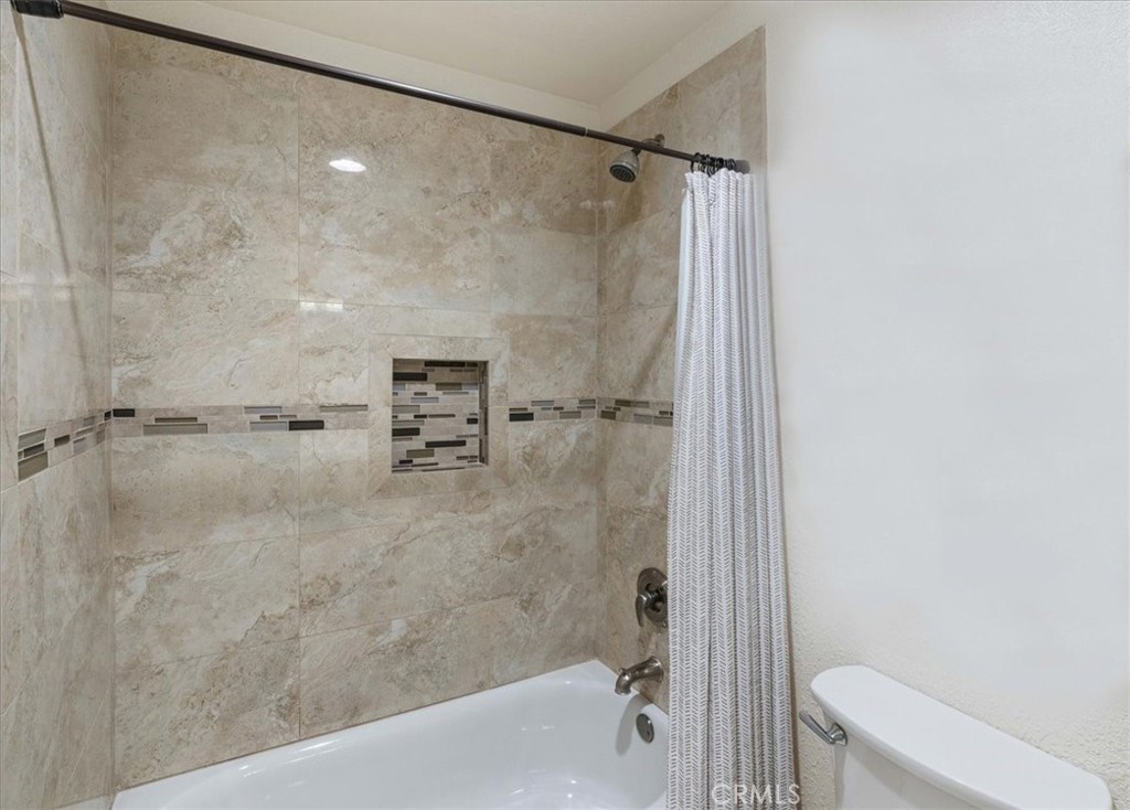 106 Bracebridge Court Riverside, CA 92506 - Photo 26 of 48 a bathroom with a shower and a toilet