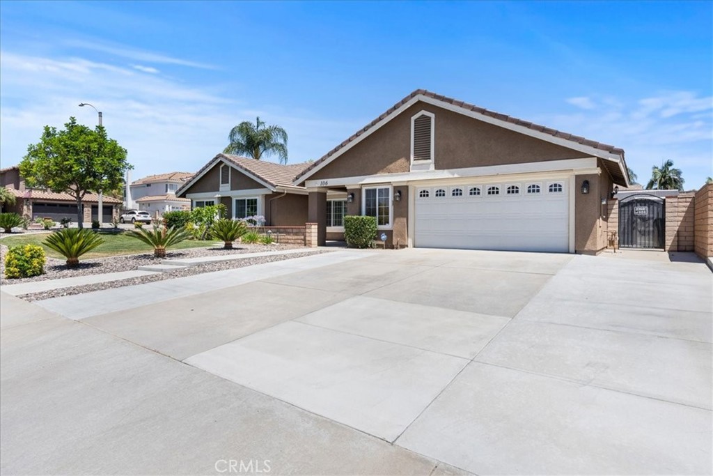 106 Bracebridge Court Riverside, CA 92506 - Photo 3 of 48 a front view of a house with a yard and garage