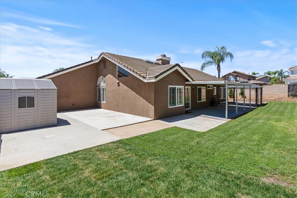 106 Bracebridge Court Riverside, CA 92506 - Photo 32 of 48 a front view of a house with a yard and garage