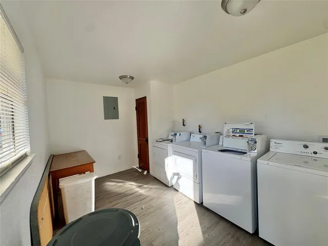 a room with a sink and a washer dryer
