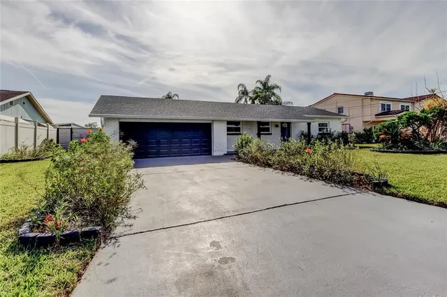a view of a kitchen with a sink and a refrigerator