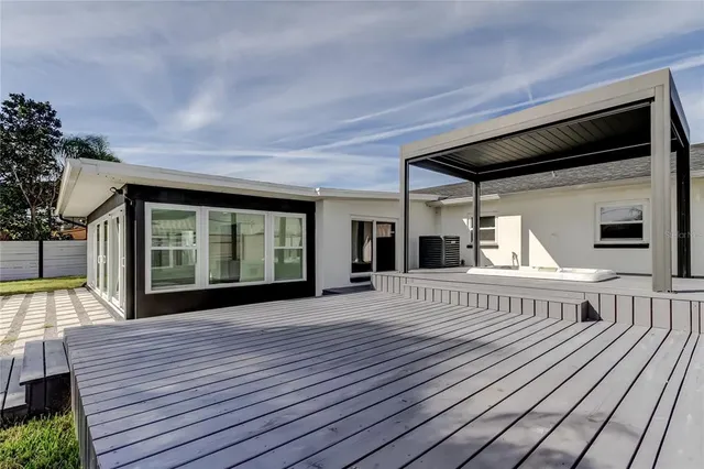 a view of balcony with furniture and wooden floor