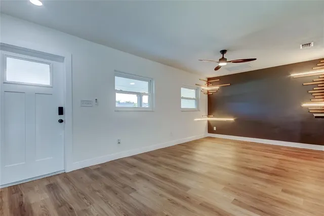 a kitchen with stainless steel appliances granite countertop a sink and a stove