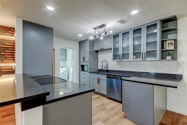 a close view of a stove a microwave and cabinets