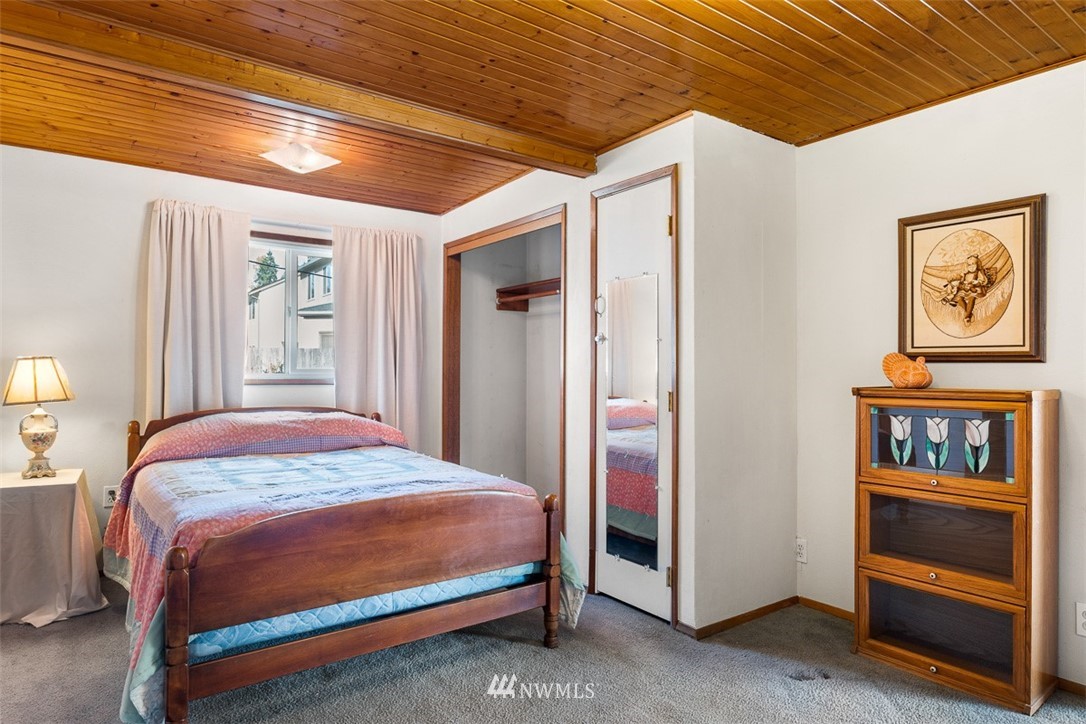 3037 Talbot Road South Renton, WA 98055 - Photo 14 of 29 a bedroom with a bed and a window