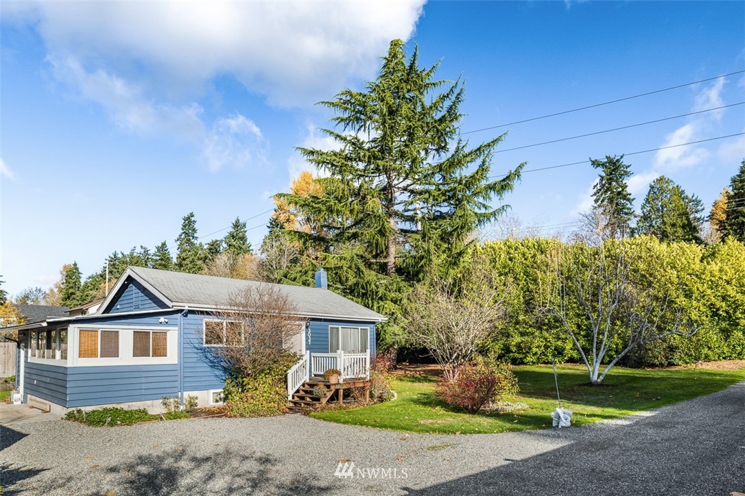 3037 Talbot Road South Renton, WA 98055 - Photo 3 of 29 a front view of a house with garden