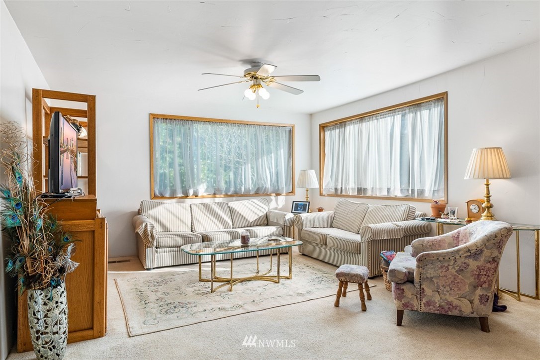 3037 Talbot Road South Renton, WA 98055 - Photo 7 of 29 a living room with furniture and a large window