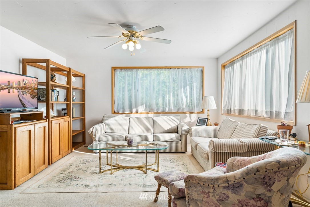 3037 Talbot Road South Renton, WA 98055 - Photo 8 of 29 a living room with furniture and a large window