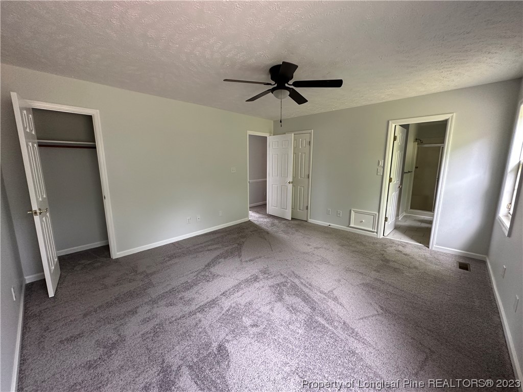 4531 Mobius Road Fayetteville, NC 28312 - Photo 8 of 18 a view of a livingroom with a ceiling fan and window