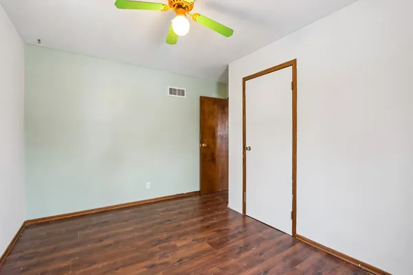 a view of room with window and cabinet