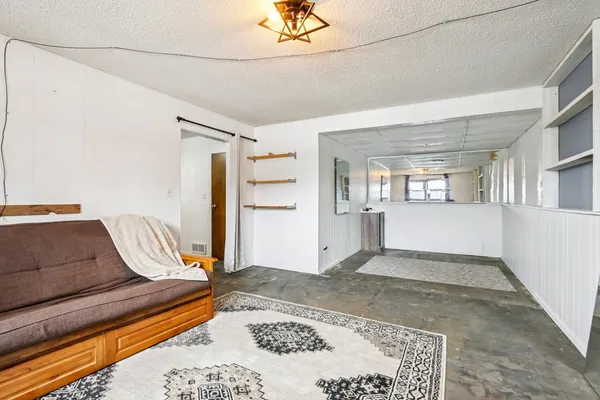 a living room with furniture and a rug