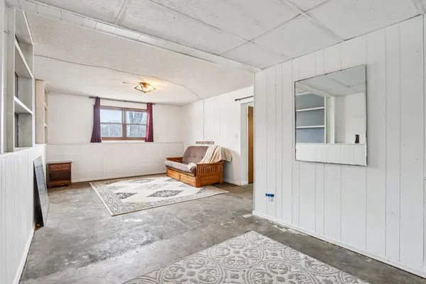 a bathroom with a sink a toilet and shower curtain