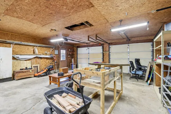 a view of white house with a snow on the road