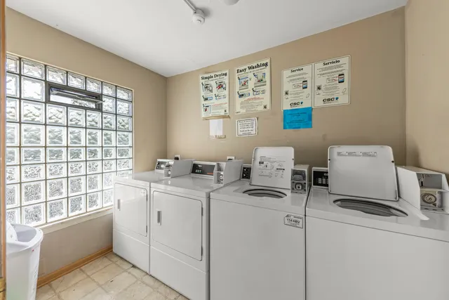 a front view of a house with a garden and porch